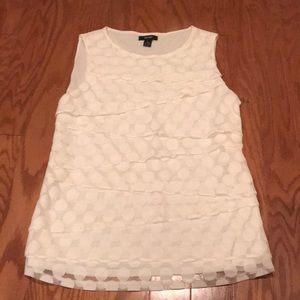 White polka dot sleeveless blouse
